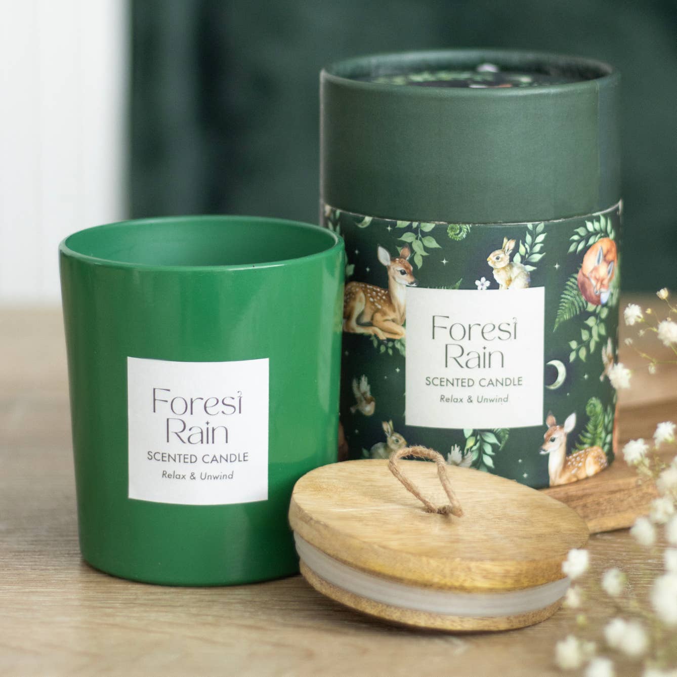 Forest Rain scented candle with green glass jar and illustrated tube
